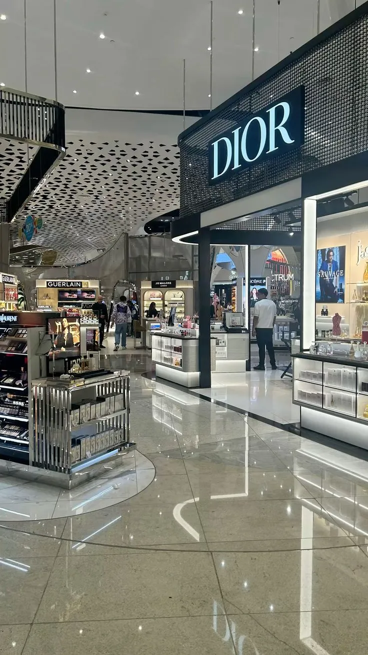 A luxury beauty boutique on a polished mall concourse