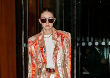 Celebrity Gigi Hadid in a jacket suit at Paris Fashion Week.