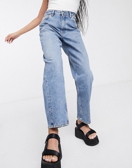 Organic cotton jeans with blue Monki turned seams.