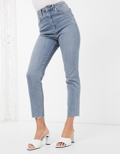 Mom high-waisted slim fit jeans with clear wash by Asos Design.