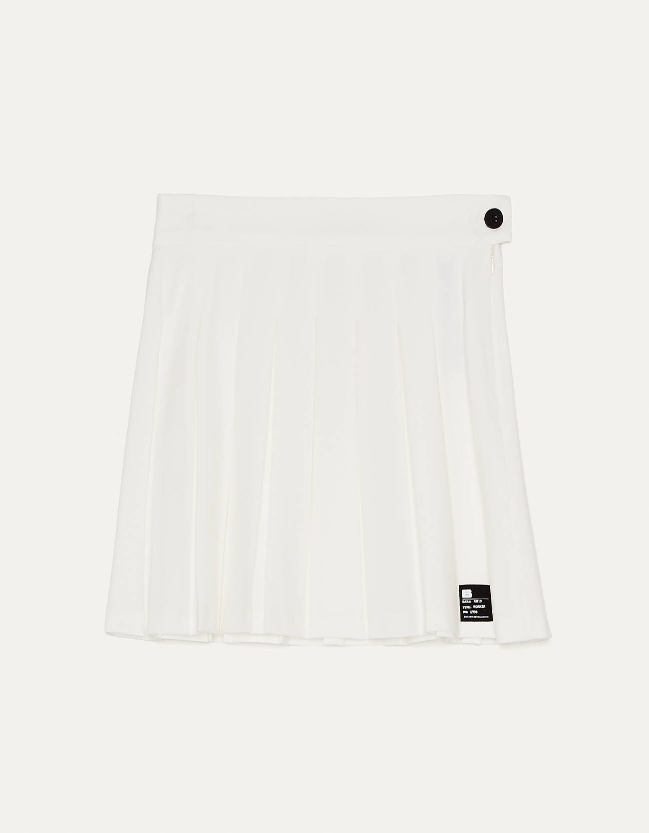 White mini pleated skirt with black details.