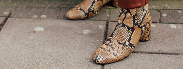 Break away from the simplicity of mid-season looks with snake print boots
