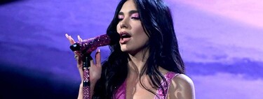 Dua Lipa shines bright on stage at the 2021 Grammy Awards in her fuchsia pink Versace look. 