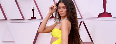 Zendaya isn't superstitious and shows up on the 2021 Oscars red carpet in a (mind-blowing) yellow dress to match her mask 