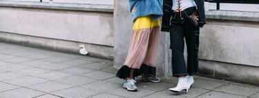 Street style shows us how to pair sneakers with a more formal look in 13 different ways