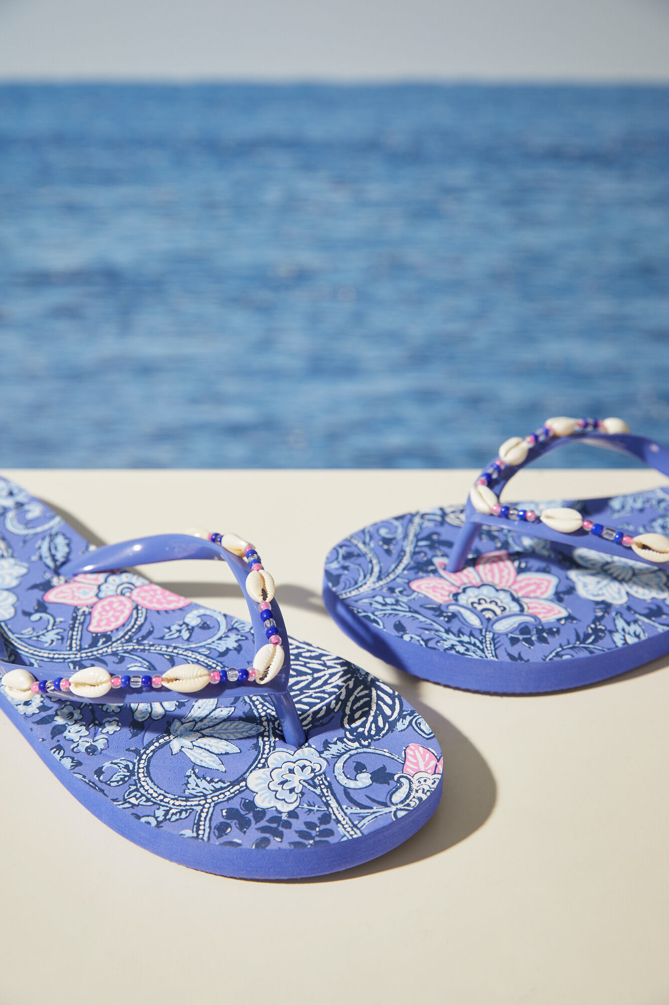 Flip flops printed with shells